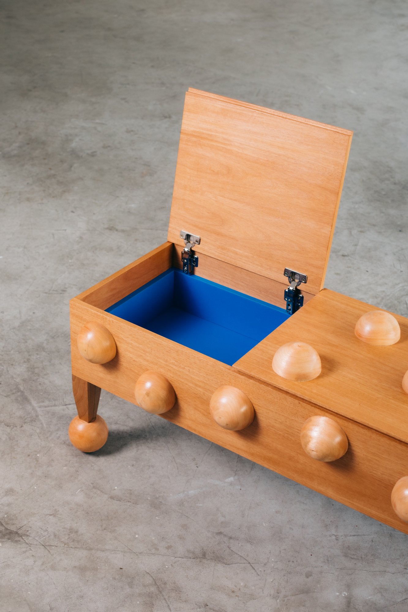 Buffet with lid open, blue interior