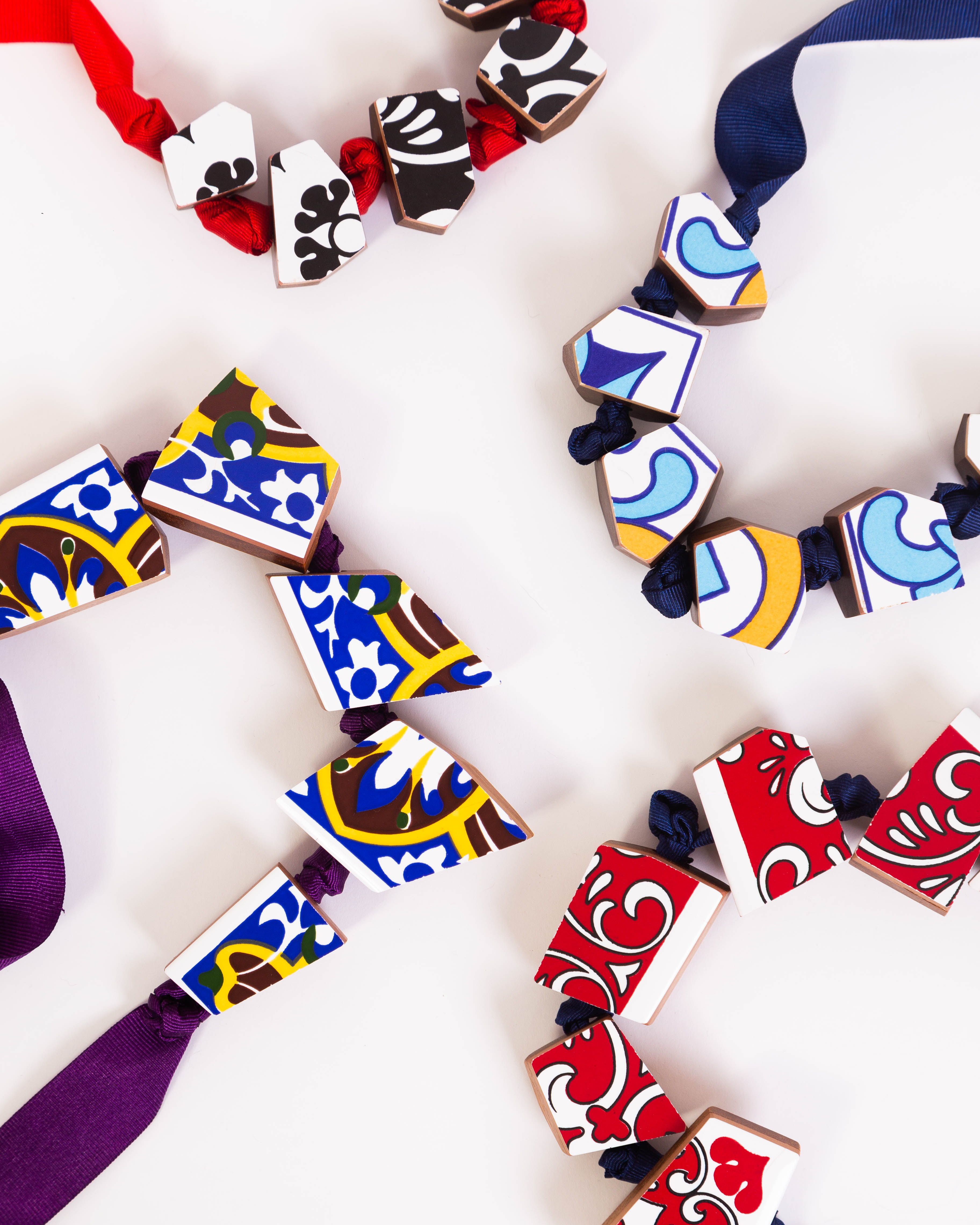 Cacos e tacos necklaces laid flat with fabric ties